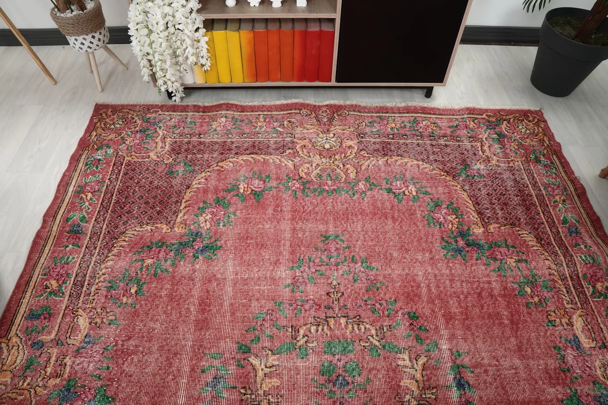 Overhead view of the rug in a room, emphasizing the medallion and field