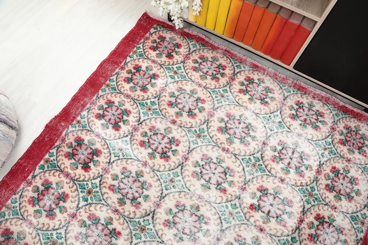 High angle view showing a section of the rug's pattern and its vintage texture