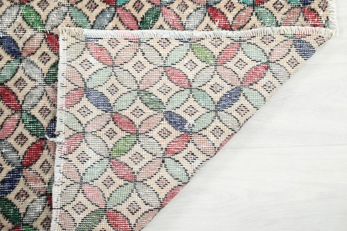Another view of the rug's reverse side, revealing the tight hand-knotting and foundation