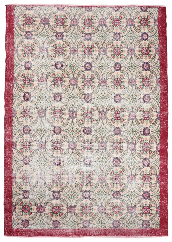 Full top view of the cream floral medallion vintage Anatolian rug with a red border