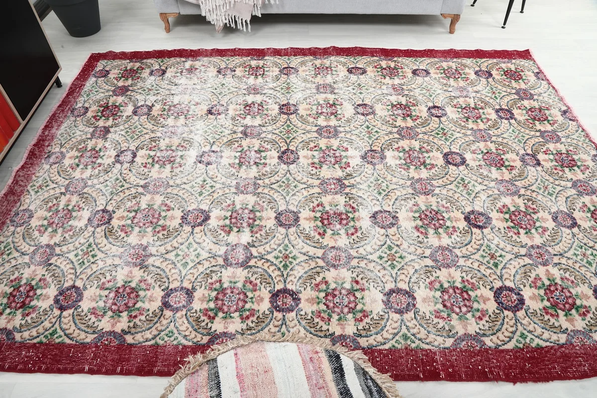 Full view of the rug on the floor, emphasizing its size and design in a neutral space