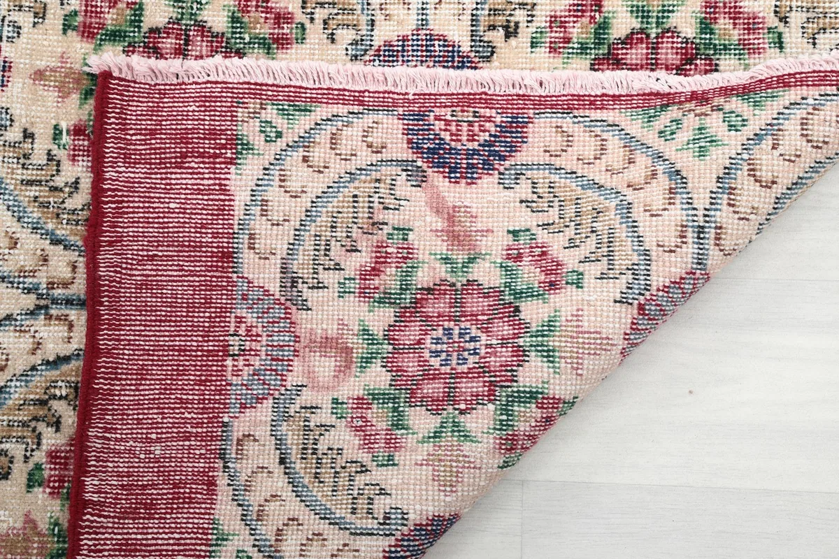 Close-up of the back of the rug, revealing the tight hand-knotted wool construction