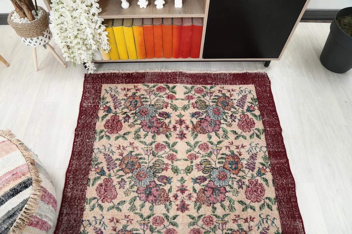 Overhead view of the rug, showing its rectangular shape and the symmetry of the floral design.