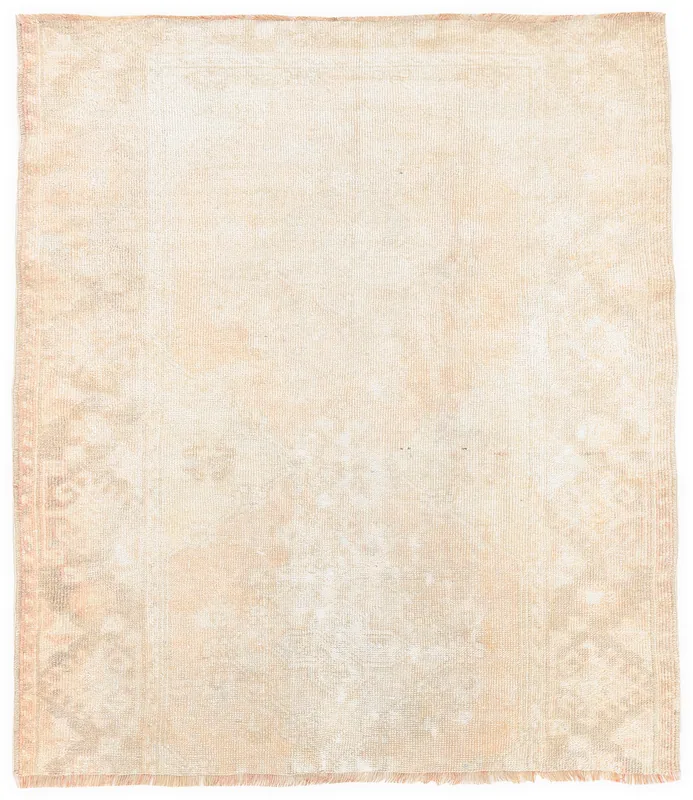 Full overhead view of the beige 4x4 vintage Anatolian rug with faded geometric patterns