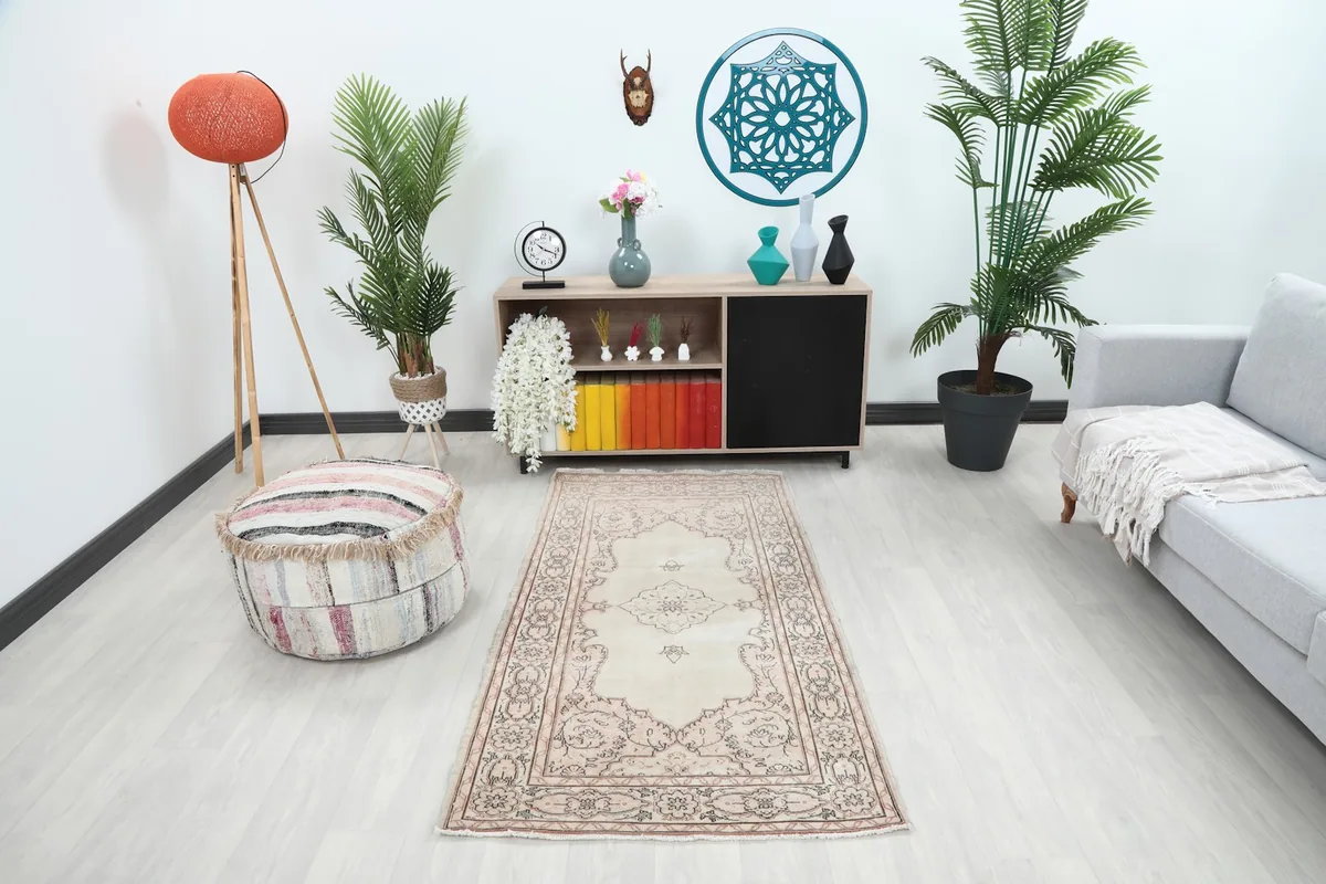 Vintage Anatolian rug displayed in a living room setting with modern furniture