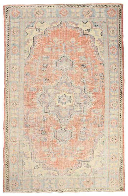 Full overhead view of the rust medallion Anatolian rug on a white background.