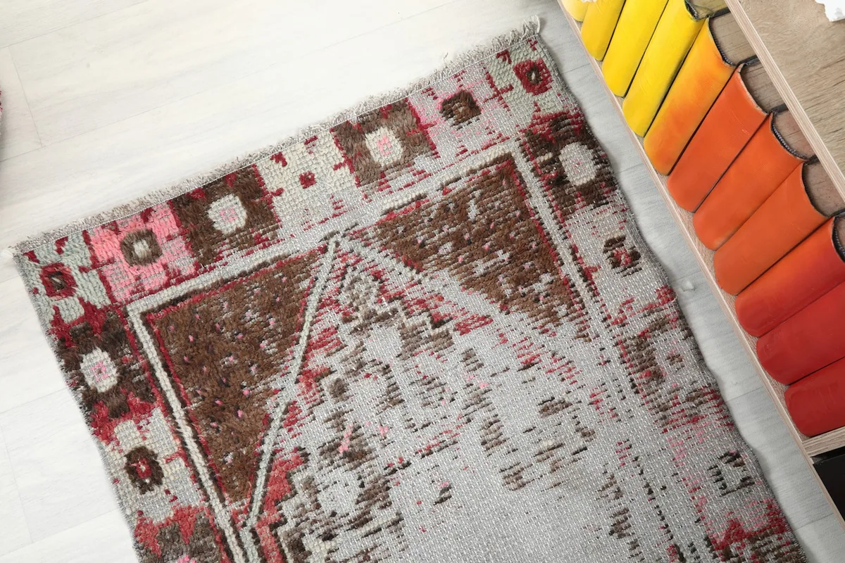 Overhead view showcasing the full tribal pattern and border details of the rug.