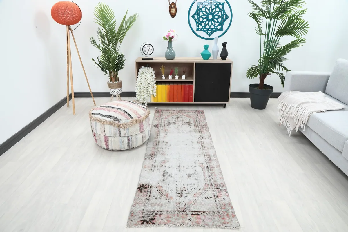 Vintage runner rug in a modern living room setting, viewed from the front