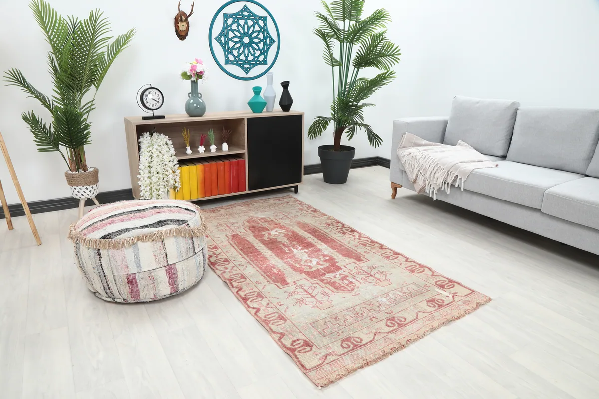 Faded Rose Geometric Anatolian Rug from an angled perspective in a room, highlighting its placement versatility.