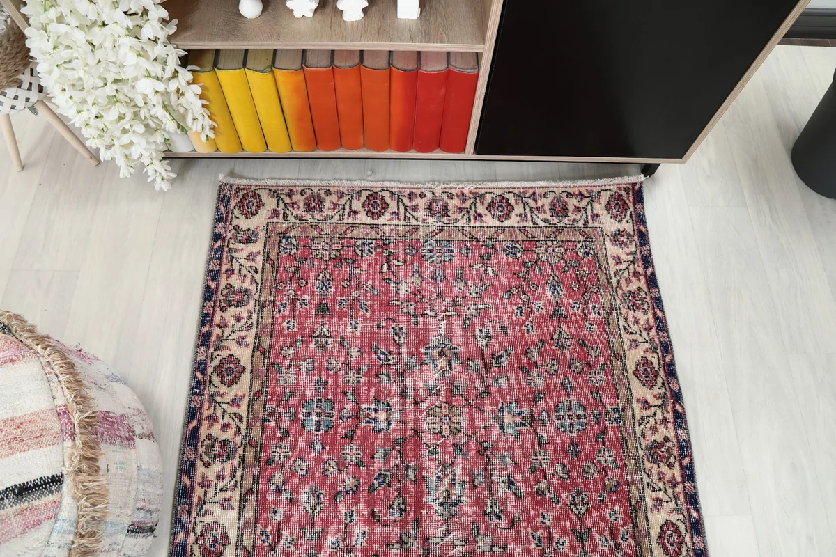 Top-down view of the rug in a room setting, showcasing its full pattern and color distribution