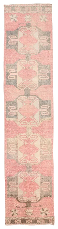 Full top view of the 2'9" x 12'5" vintage Anatolian runner with rose, gray, and beige geometric patterns.