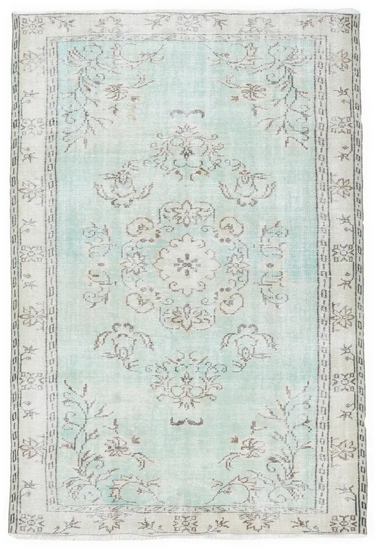Full overhead view of the green and beige floral vintage Anatolian rug
