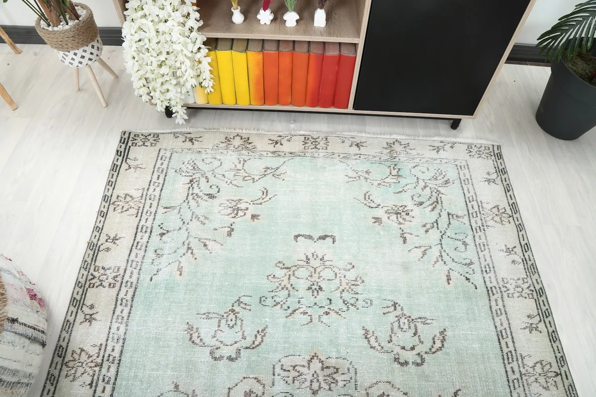 Wider angle showing the rug's placement in the room, highlighting its size and design