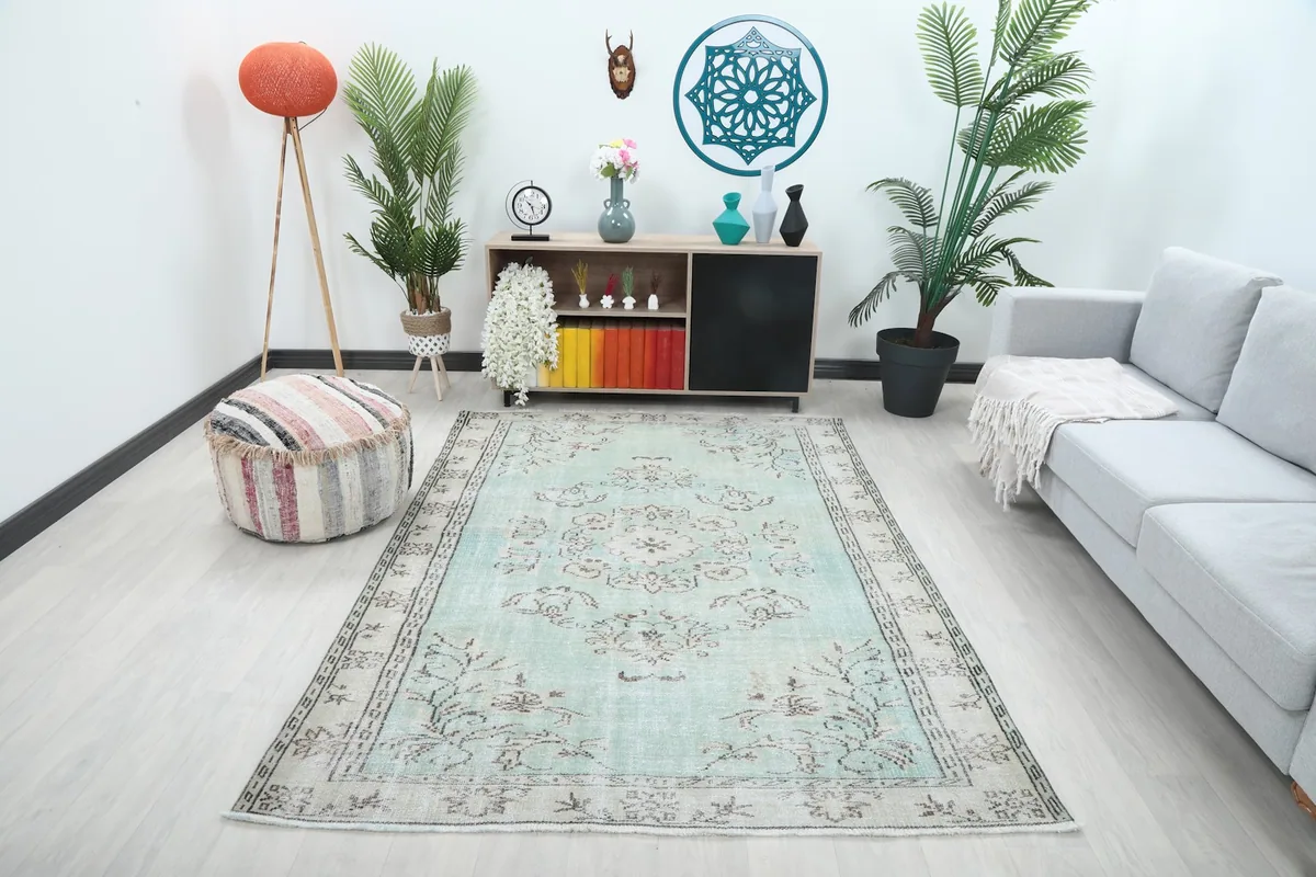 Vintage Anatolian rug displayed in a modern living room setting