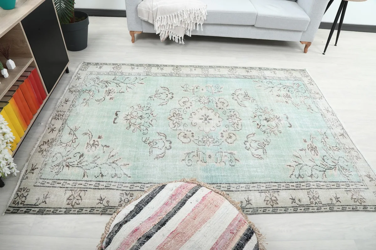 Full room view with the rug as a focal point, showing its overall color and pattern
