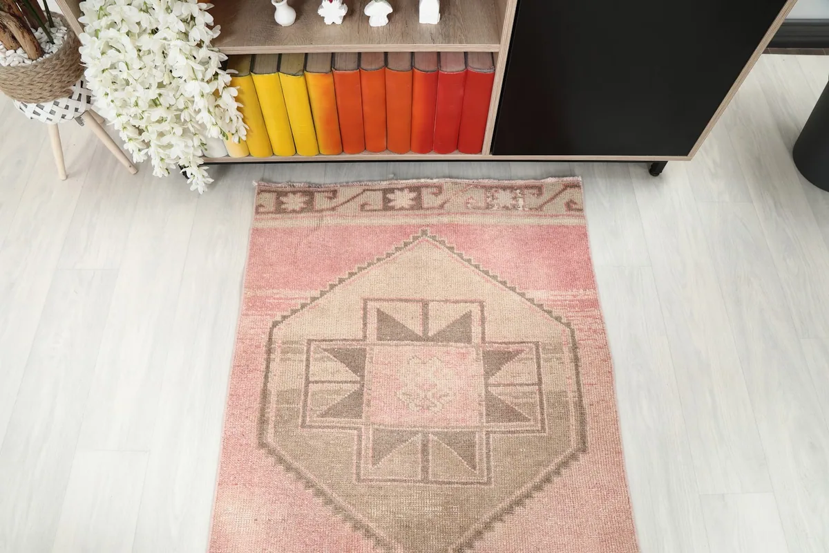 Overhead view of one end of the runner rug, showing the geometric design
