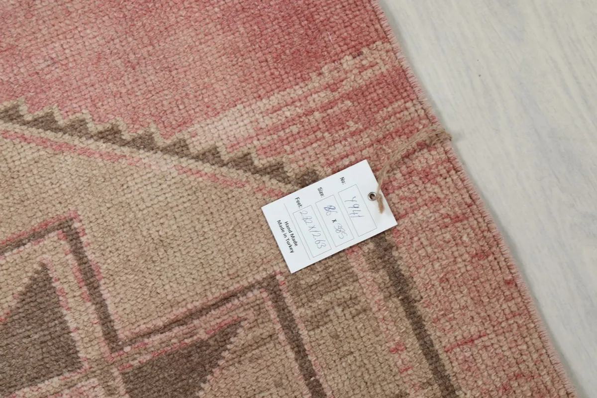 Close-up showing the texture of the rug's pile and a product tag