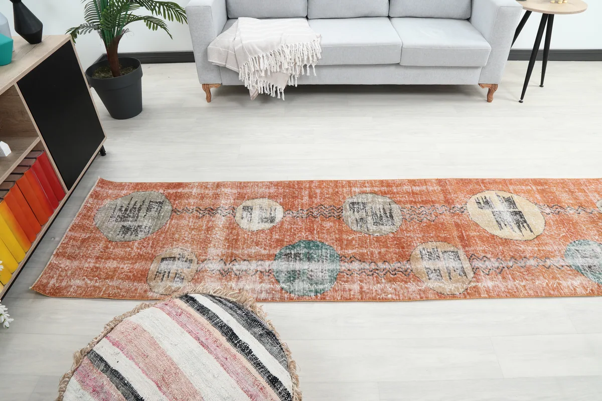 Rust Geometric Oval Runner laid out in a contemporary room, showing its full design and scale.