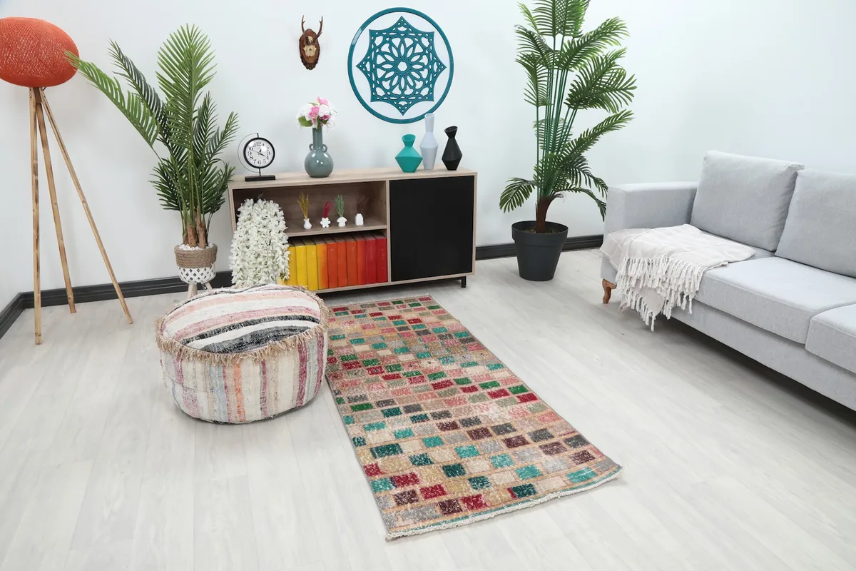 Angle view of the geometric runner rug placed in a stylish room with contemporary furniture