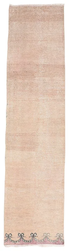 Full top view of the 2'4" x 9'7" beige Anatolian runner with a subtle border pattern