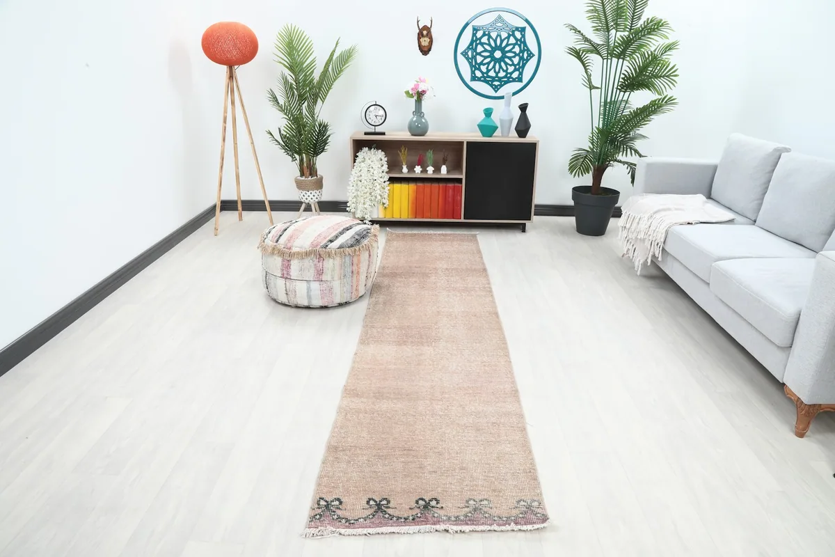 Runner rug displayed in a living room setting, showing its scale and color in a home environment