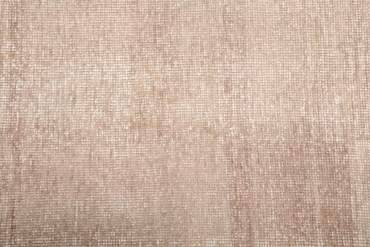 Close-up of the low wool pile and hand-knotted construction of the beige runner rug