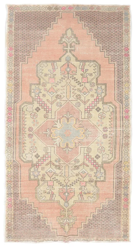 Full overhead view of the vintage Anatolian rug with a rose field and brown border, featuring a central medallion.