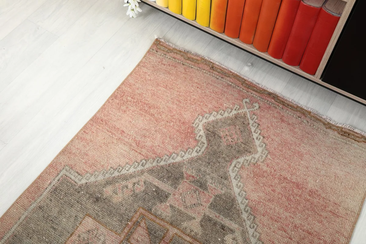 Angled view of the runner's end, with subtle color variations and a patterned border