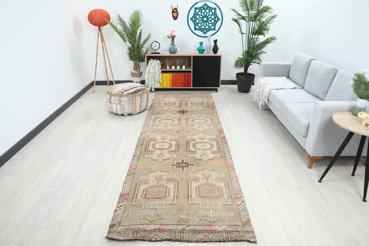 Vintage Anatolian runner rug displayed in a modern hallway setting, showcasing its length and scale.