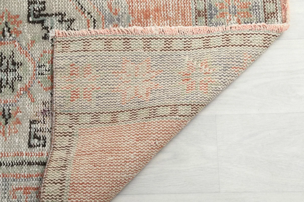 Underside view of the hand-knotted wool pile on cotton foundation