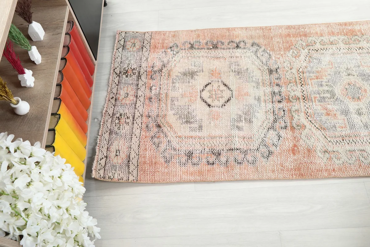 Partial view of the runner rug, showing the transition of color and pattern along its length