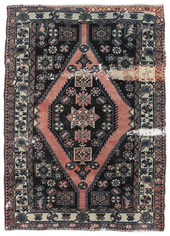 Full top view of the 4'7" x 6'4" rose and black vintage Anatolian rug with geometric patterns