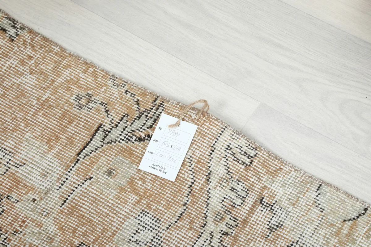 Close-up of the rug's label attached to the corner, showing product information