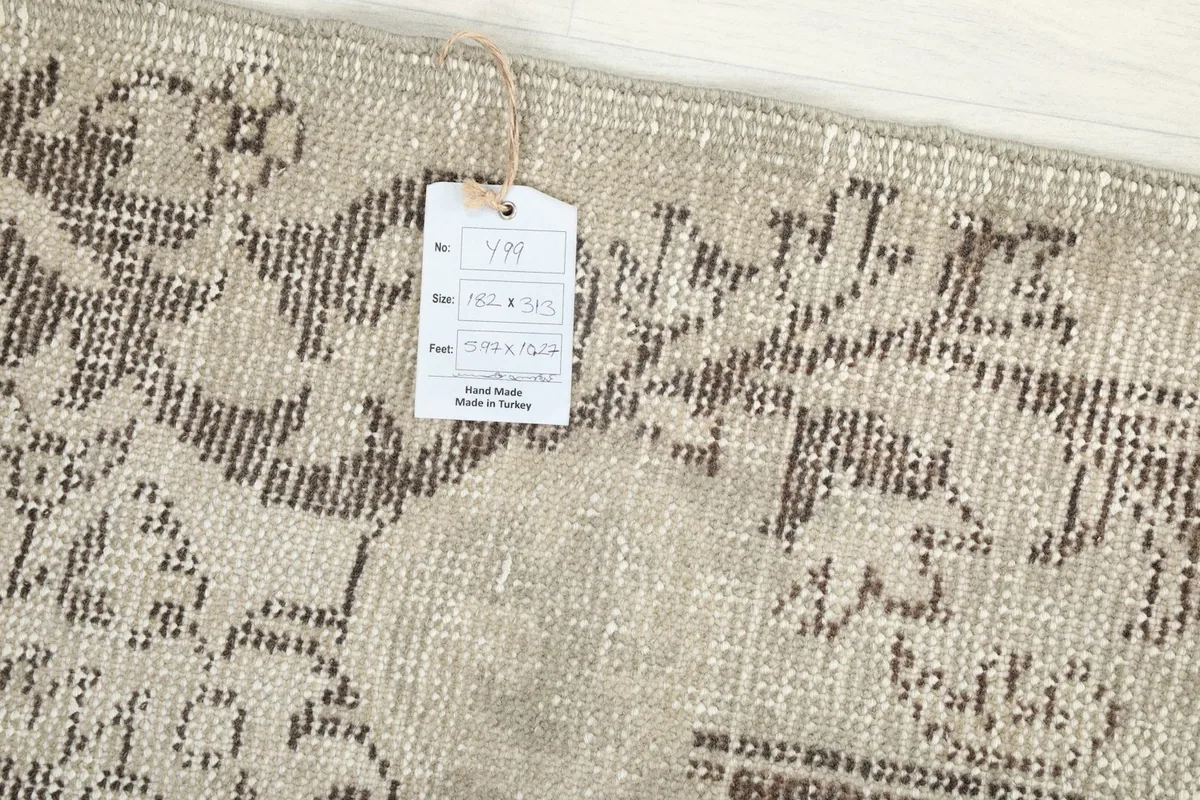 Product tag attached to the rug, displaying size and origin information