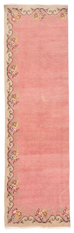Full overhead view of the pink and beige floral Anatolian runner rug
