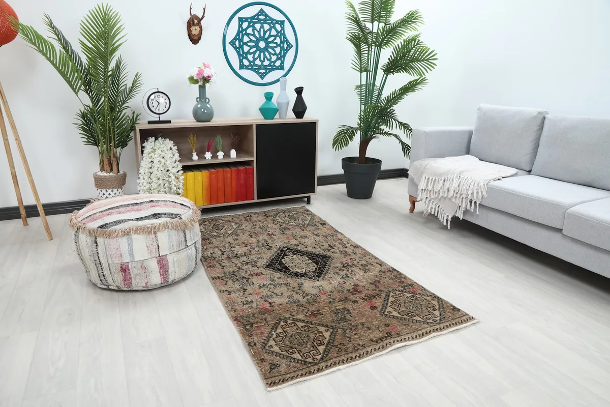 Angle view of the beige tribal geometric rug placed in a living space