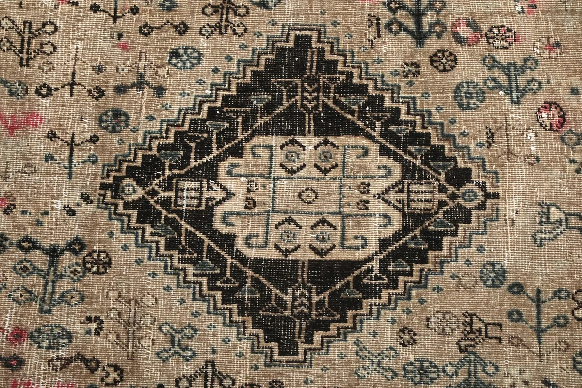 Close-up of the intricate central black and beige geometric medallion