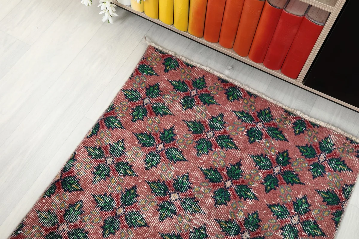 Angle view of the runner rug's end, showing the pattern and slight fringe