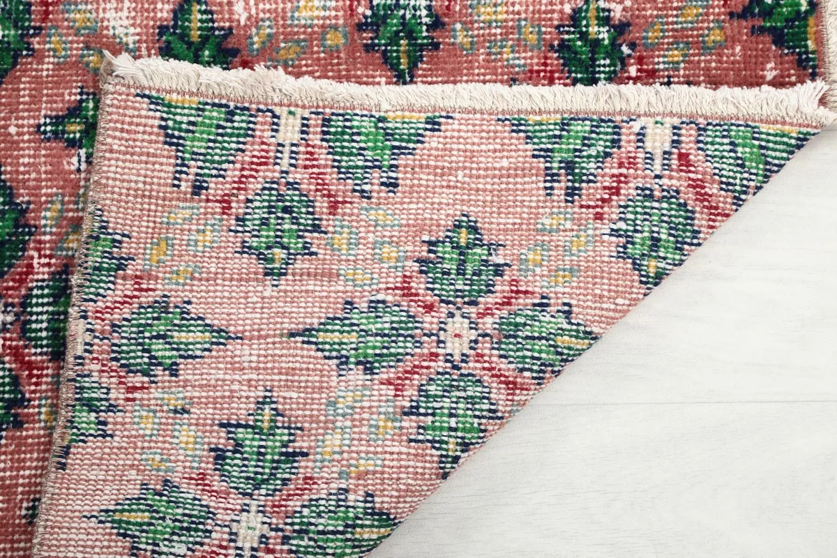 Close-up of the back of the rug, showing the hand-knotted construction